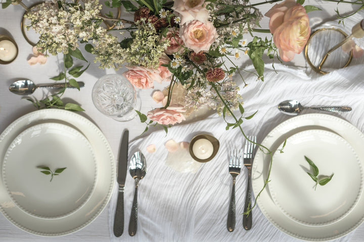 files/a-dining-table-filled-with-floral-decoration.jpg